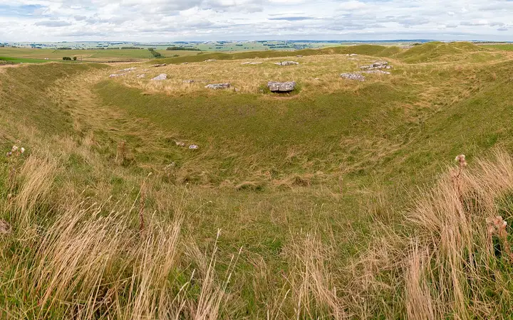 Arbor Low henge with fallen slabs on a limestone plateau