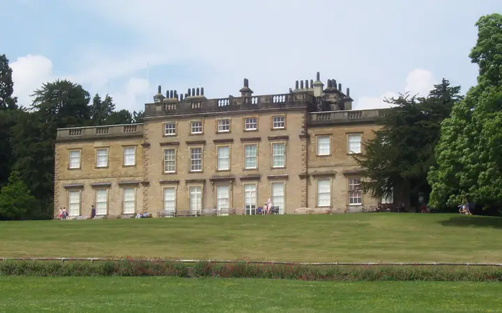 The long Georgian front of Cannon Hall above its lawns