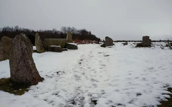 Easter Aquhorthies recumbent stone circle on a snowy hillside