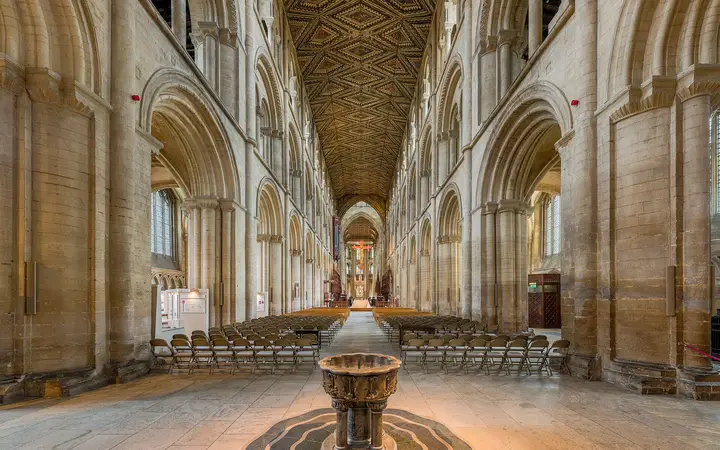The long nave of Peterborough Cathedral with its painted ceiling