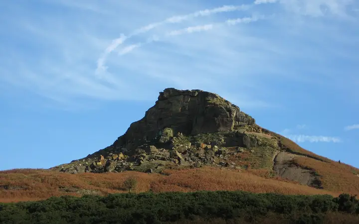 The half-cone summit of Roseberry Topping above fields