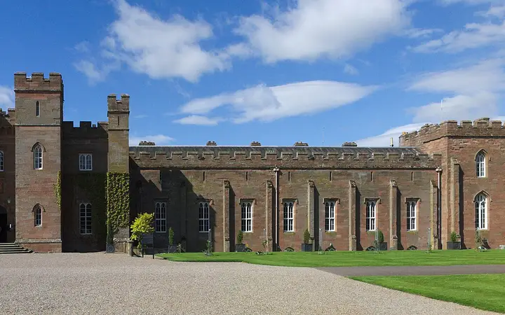 The red sandstone Scone Palace among trees