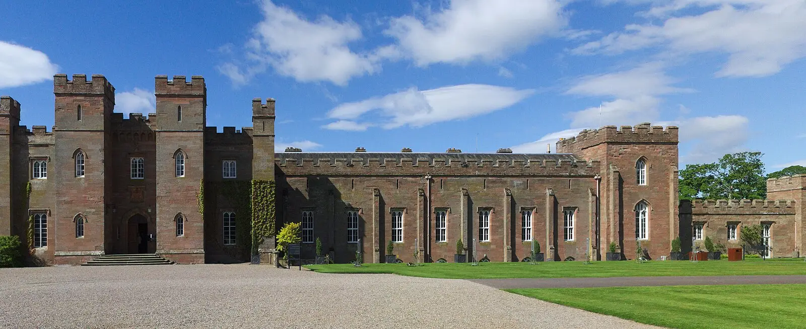 The red sandstone Scone Palace among trees