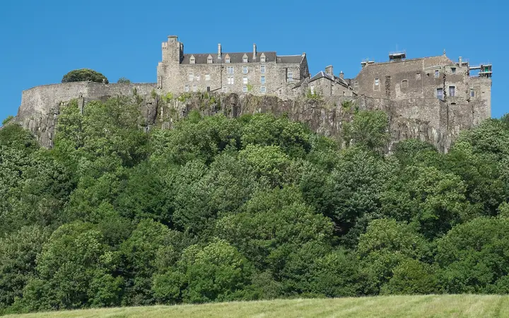Stirling Castle on its rock above trees