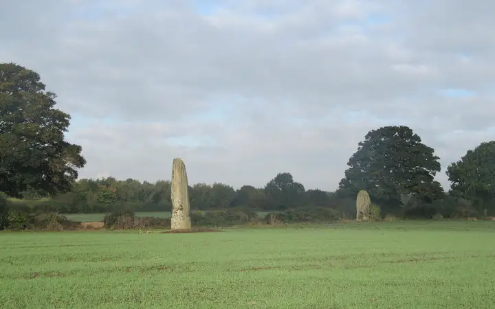 Tall standing stones of the Devil's Arrows in a field