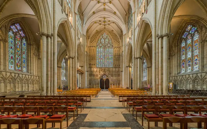 The vaulted nave of York Minster lit through tall medieval windows